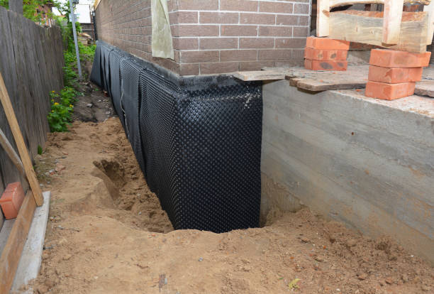 Happy homeowners after waterproofing job in Boyce